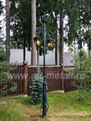Wrought iron street lamp with built-in CCTV camera.