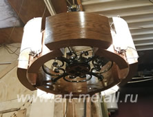 Original ceiling chandelier made of oak and forged elements. 