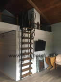 Wrought iron retractable staircase with oak steps. 